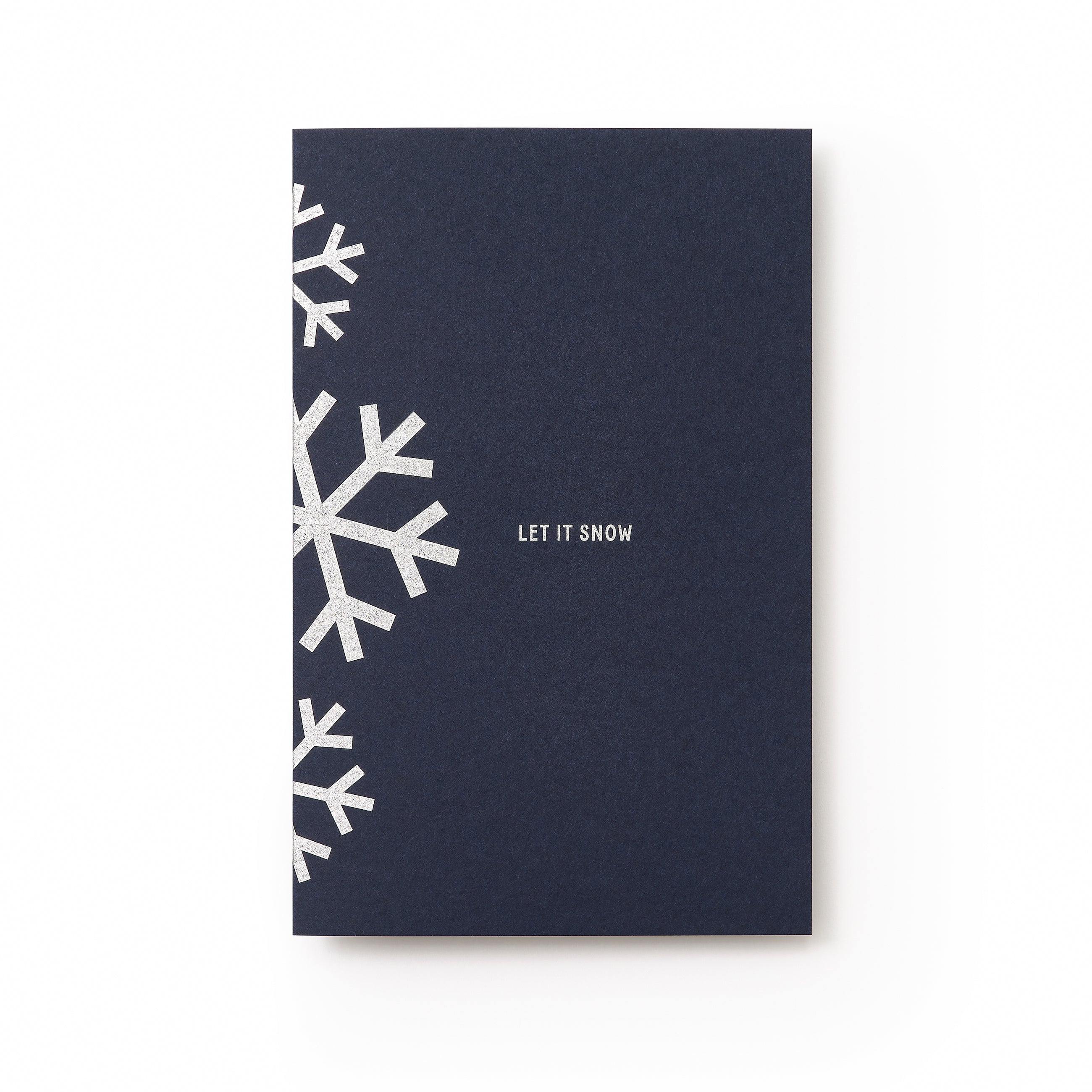 A dark blue holiday card with silver geometric snowflakes along the left edge and the text "LET IT SNOW" in silver at the center.