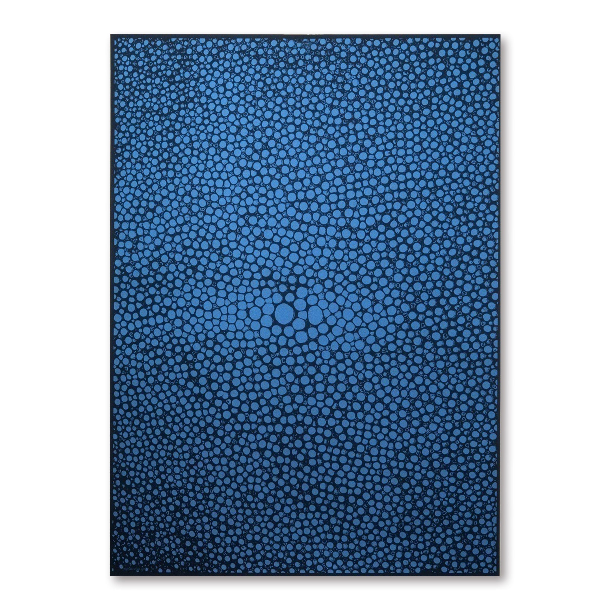 A dark blue gift wrap covered with dense, organic dot shapes in lighter blue, creating a pebble-like, flowing pattern across the surface.