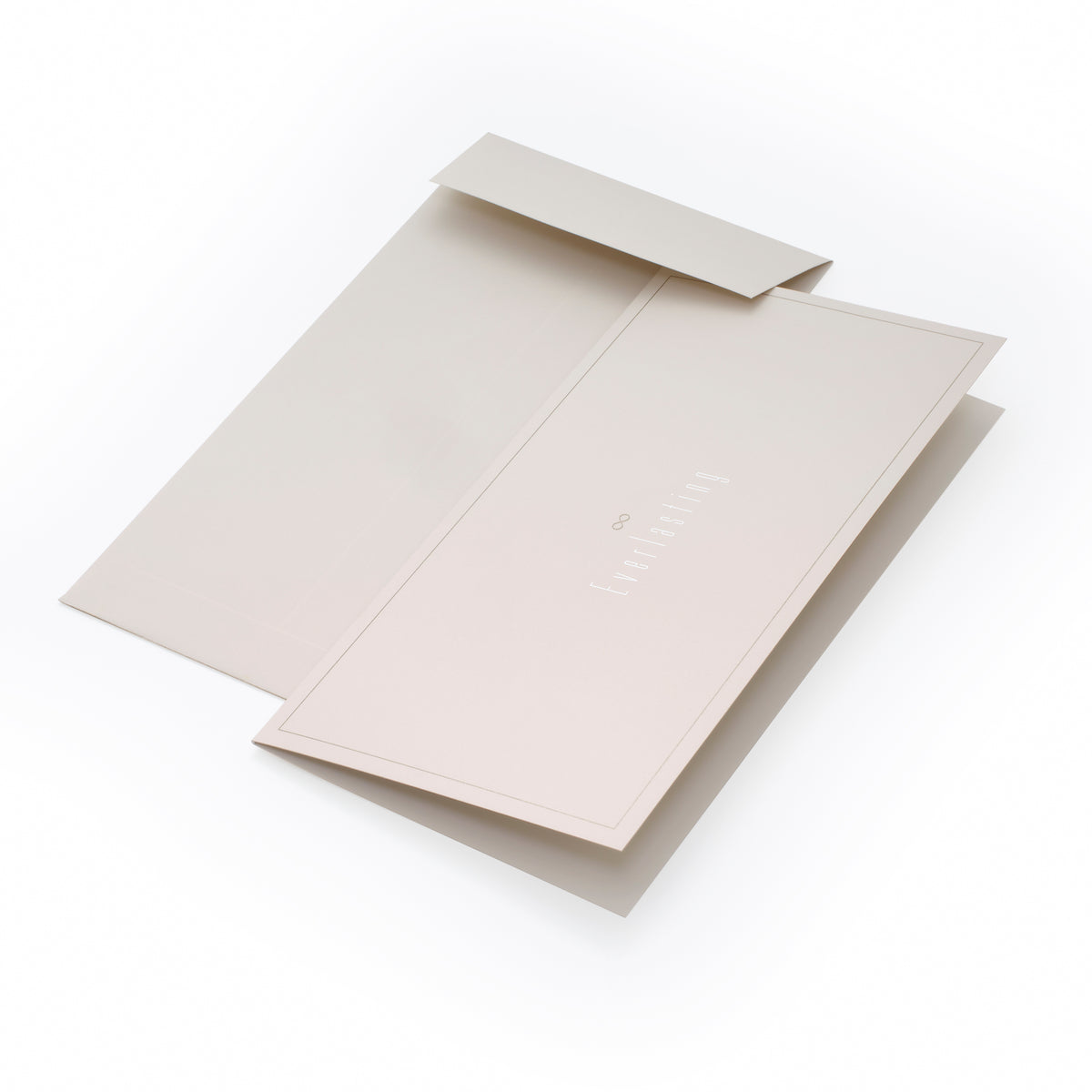 A beige folded card with a matching envelope, shown slightly open, featuring subtle embossed text reading “Everlasting” with a small infinity symbol.