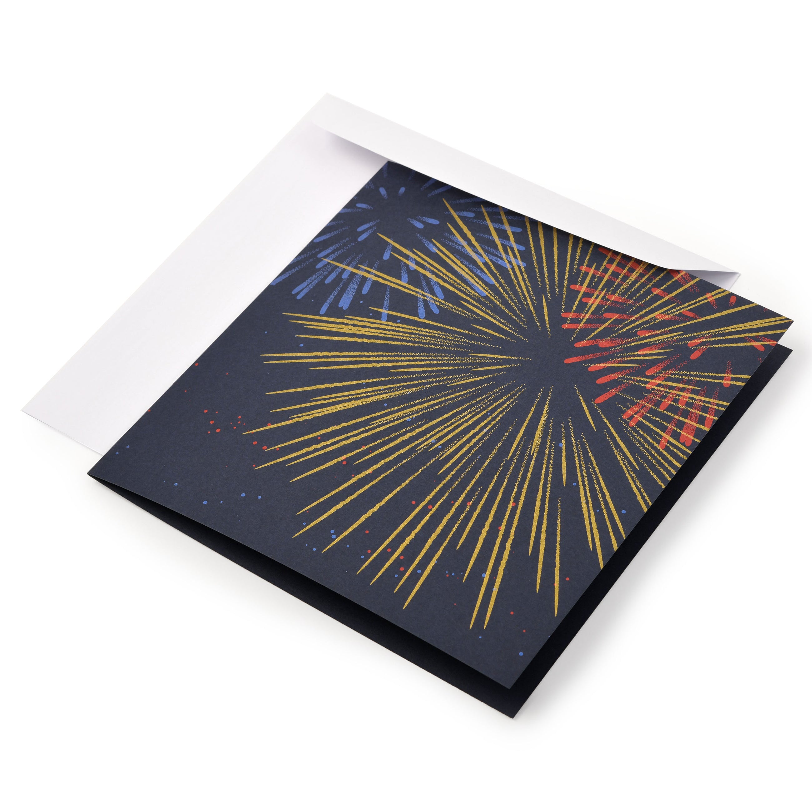 A dark blue greeting card with a bold fireworks design in gold, red, and blue bursts across the front, shown with a plain white envelope.