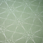 Wrapping paper with a festive pattern of fine white star outlines scattered across a muted sage-green background.