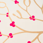 Wrapping paper with a festive pattern of golden mistletoe branches accented by bright pink berries on a soft cream-white background.