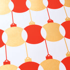 Wrapping paper with a festive pattern of red and gold baubles arranged in a bold geometric row across a bright white background.