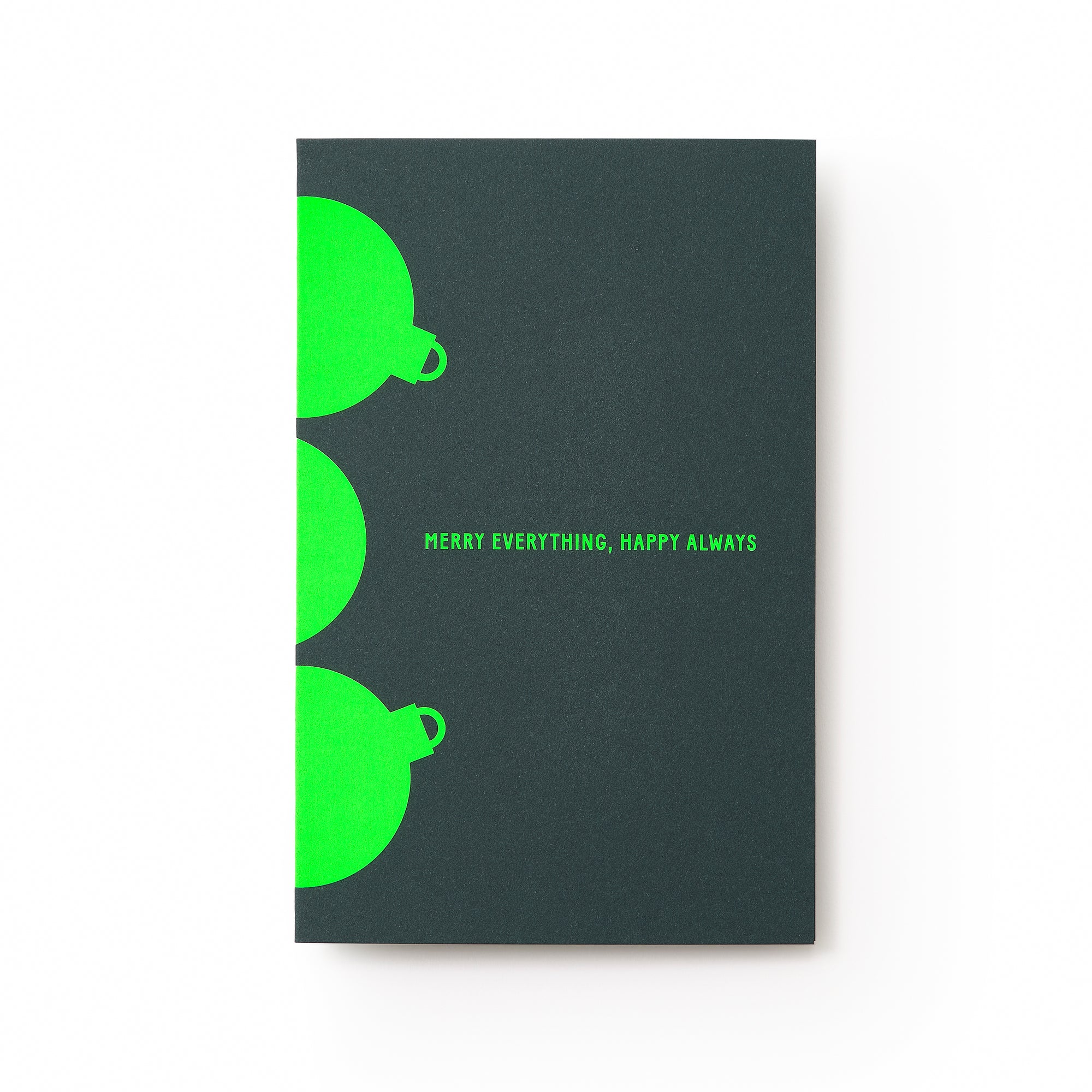 A dark green holiday card with bright neon green ornament shapes along the edges and the text "MERRY EVERYTHING. HAPPY ALWAYS" in matching neon green at the center.