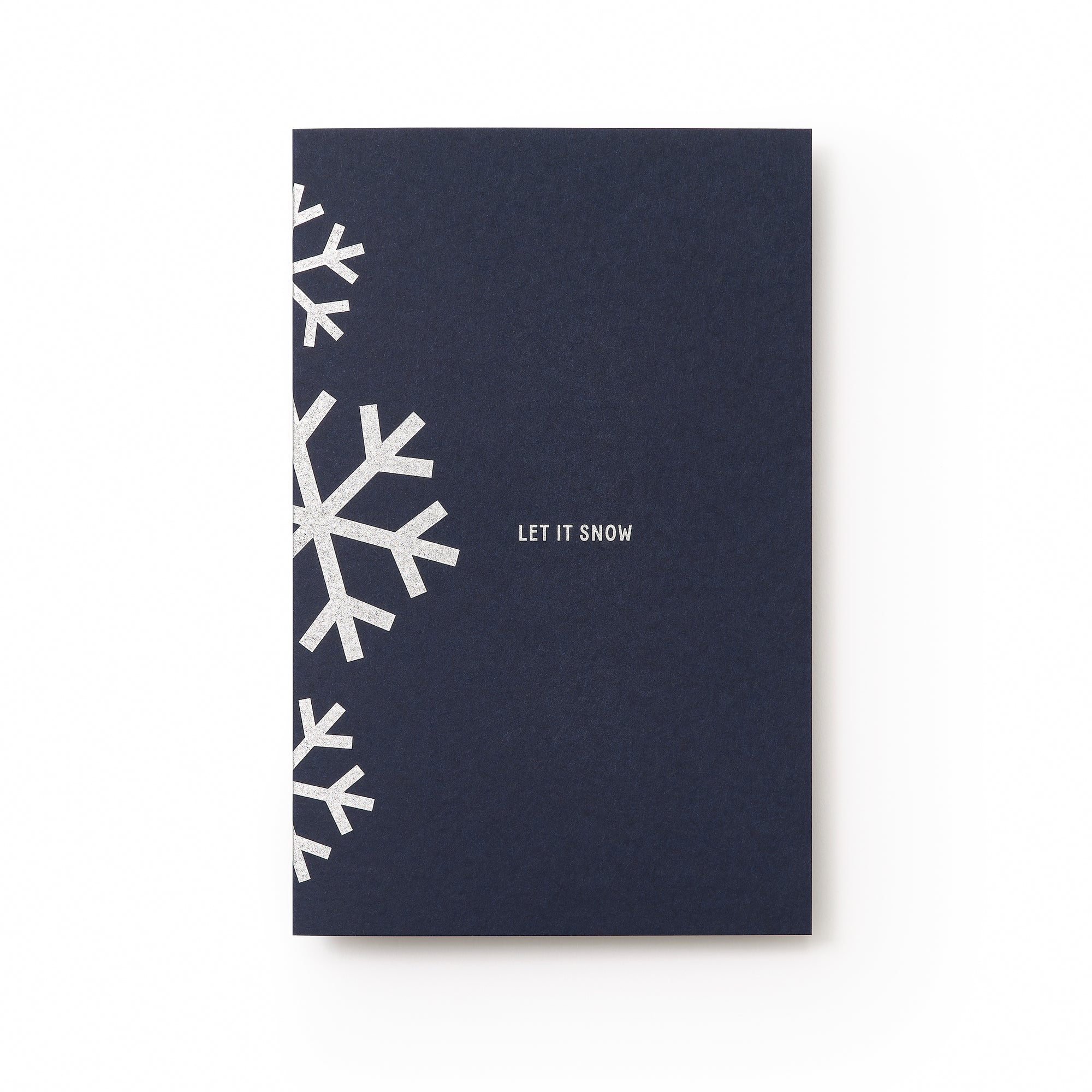 A dark blue holiday card with silver geometric snowflakes along the left edge and the text "LET IT SNOW" in silver at the center.