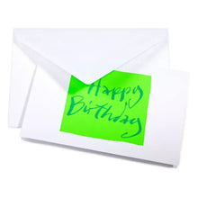 A white greeting card with a bold neon green block in the center, displaying “Happy Birthday” in expressive blue handwritten lettering, peaking out of a white envelope.