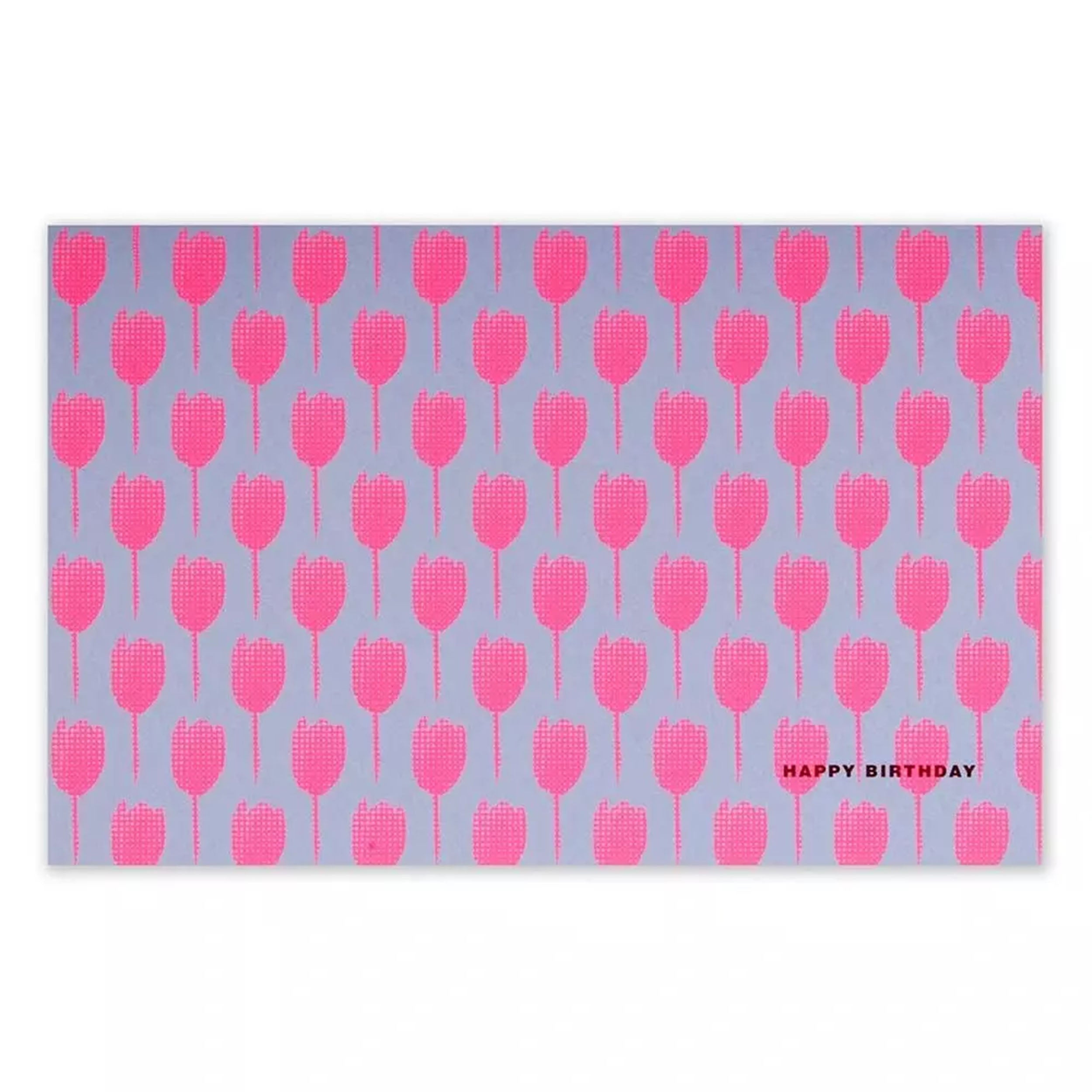 A rectangular greeting card with a lilac background, covered in a repeating pattern of bright pink tulip silhouettes, with “HAPPY BIRTHDAY” printed in small text in the corner.