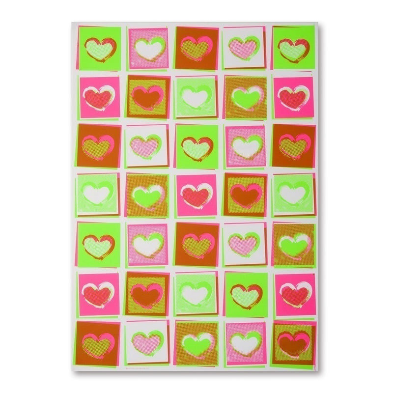 Wrapping paper with a repeating grid of neon-colored heart shapes, each set inside a square, arranged evenly across the sheet in bright pinks, greens, and reds.