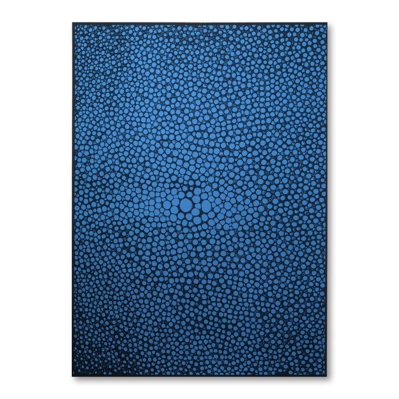 A dark blue gift wrap covered with dense, organic dot shapes in lighter blue, creating a pebble-like, flowing pattern across the surface.