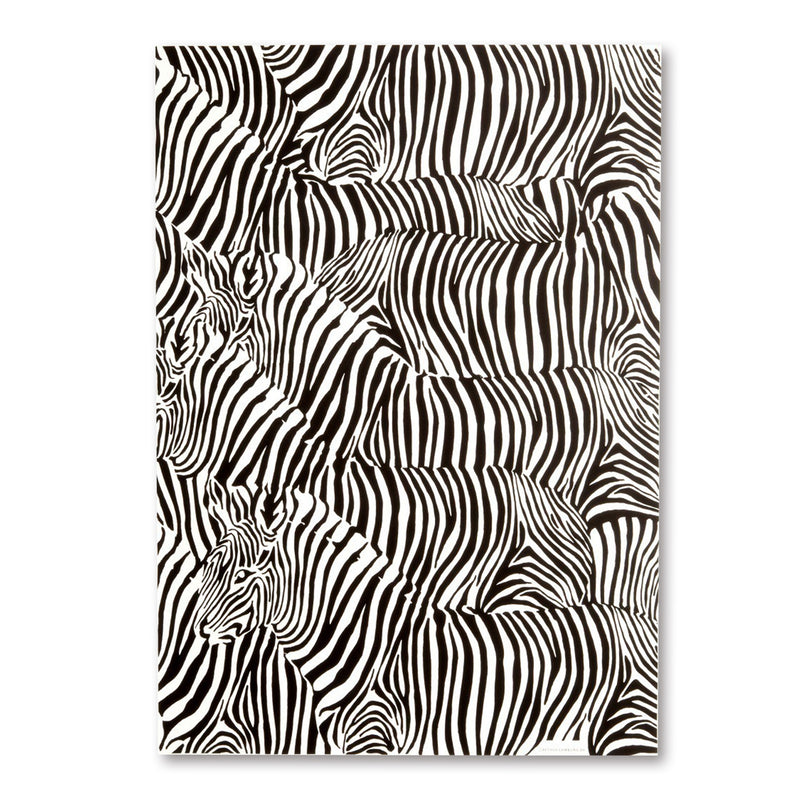 A sheet of wrapping paper filled with overlapping black-and-white zebra stripes, creating a dense, abstract animal pattern across the entire surface.