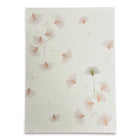 A warm ivory wrapping paper adorned with gently drifting ginkgo leaves illustrated in fine linework, highlighted by soft bronze and olive tones.