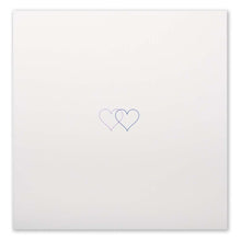 An ivory greeting card shown flat with two small overlapping hearts in pink and gold set against a clean, minimal background.