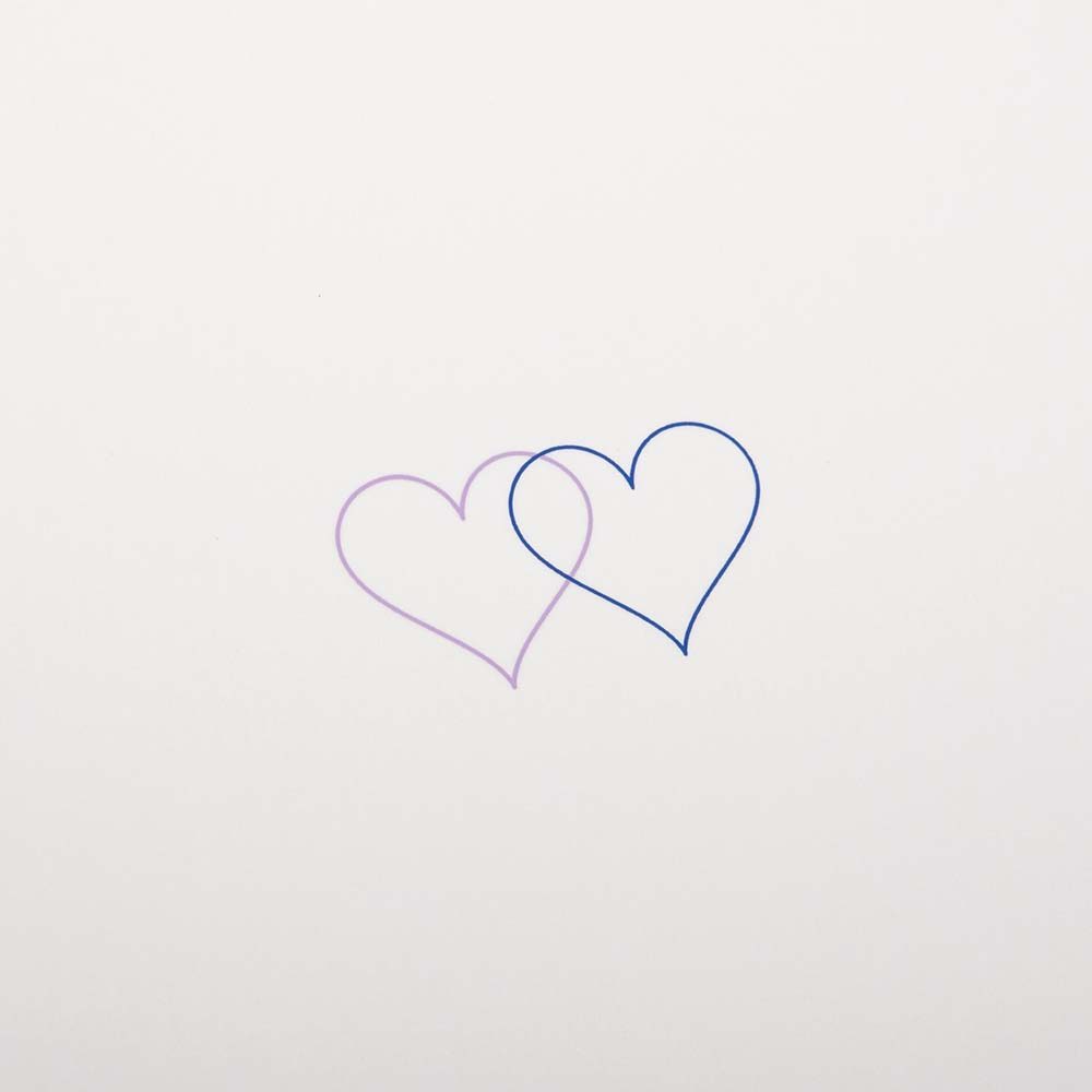 Close up of an ivory greeting card with two small overlapping hearts in blue and lilac set against a clean, minimal background.