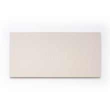 A flat beige card with a minimal border and the word “Everlasting” centered in delicate white lettering, topped by a small infinity symbol.