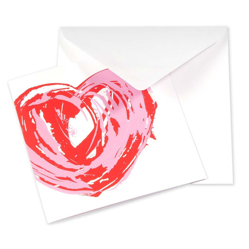 Greeting card with an expressive hand-painted heart motif in overlapping red and soft pink brushstrokes on a white background, shown partially open with a white envelope behind it.