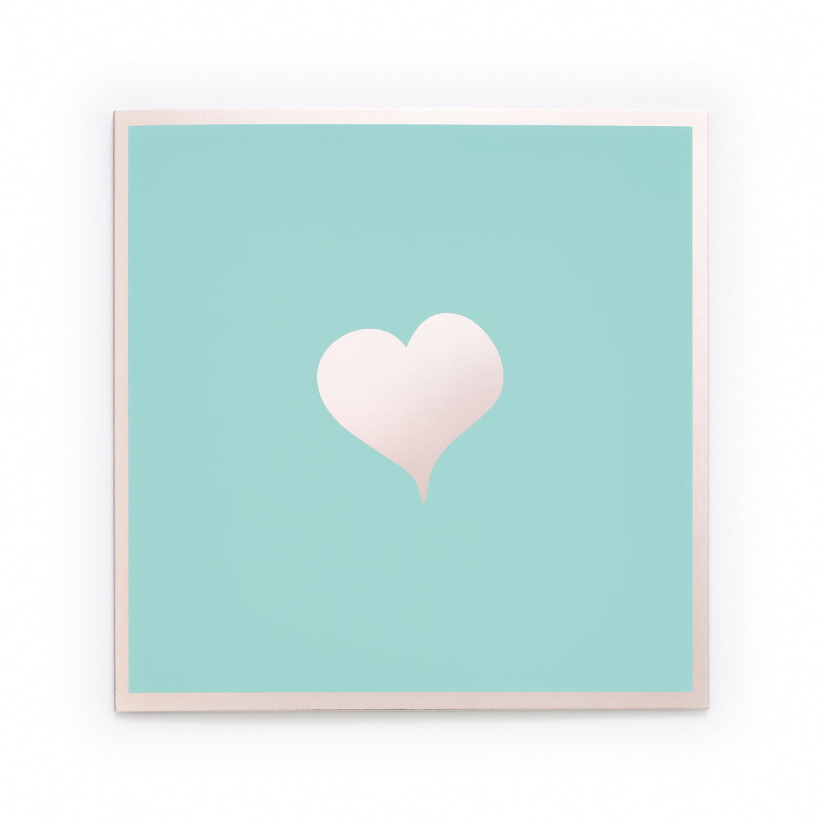Greeting card with a minimalist design, featuring a soft blush-pink heart centered on a mint-green background framed by a subtle pale-pink border, presented straight-on with a calm, airy studio feel.