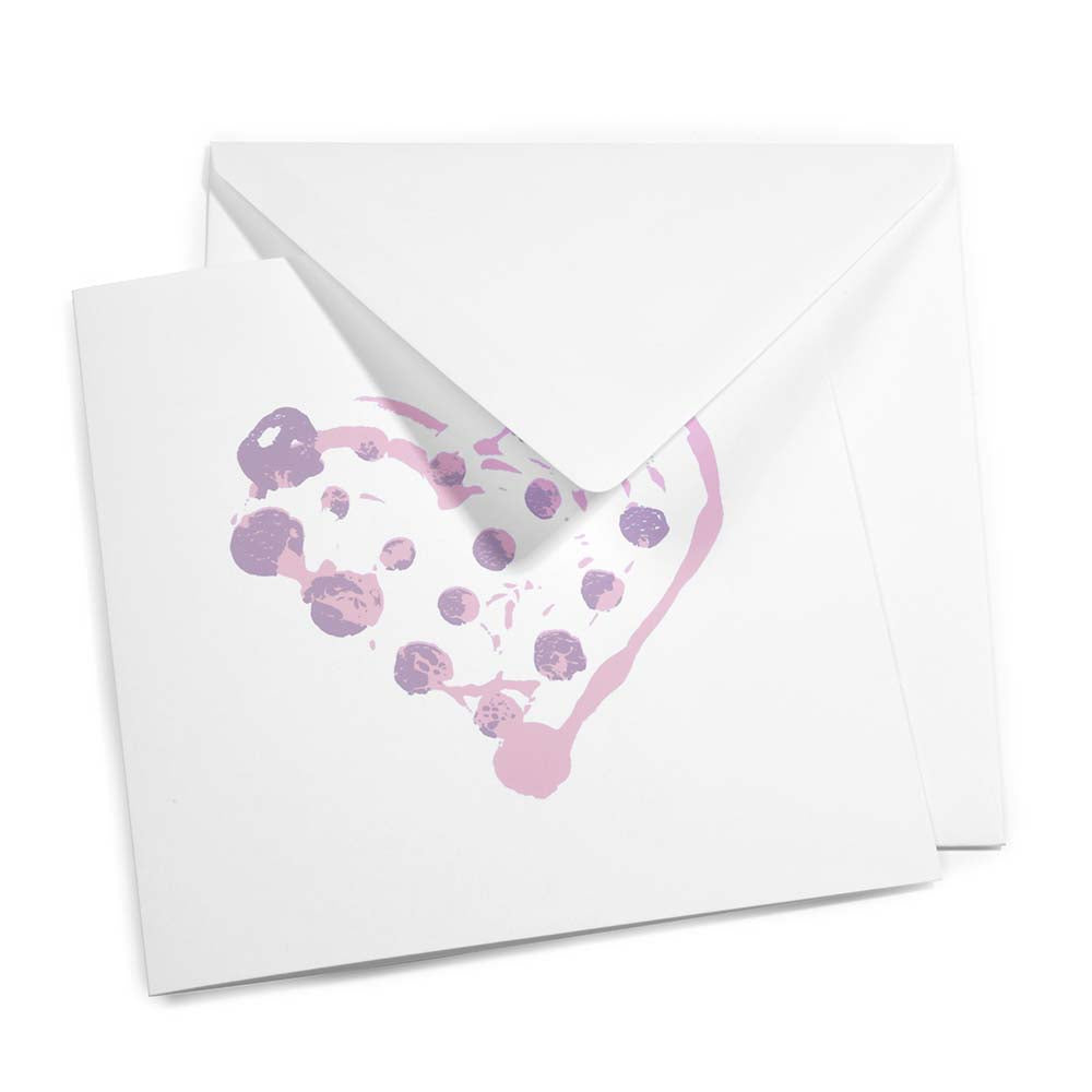 Greeting card with a minimalist design, featuring a dotted painterly heart in light pink and lavender tones, shown slightly open with a matching white envelope layered behind it.