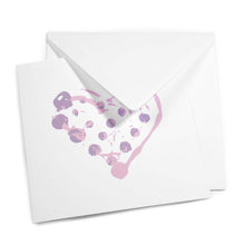 Greeting card with a minimalist design, featuring a dotted painterly heart in light pink and lavender tones, shown slightly open with a matching white envelope layered behind it.