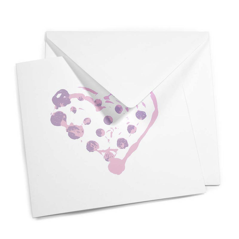 Greeting card with a minimalist design, featuring a dotted painterly heart in light pink and lavender tones, shown slightly open with a matching white envelope layered behind it.