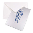 A silver greeting card partly pulled from a white envelope, showing a loose blue line drawing of two men standing side by side.