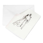 A pearlescent white greeting card shown partly pulled from a white envelope, featuring a fine black line drawing of a couple in an abstract, sketch-like style.