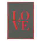 A flat-lay view of a dark grey greeting card featuring the word “LOVE” in large red letters, framed by a thin red border against a neutral background.