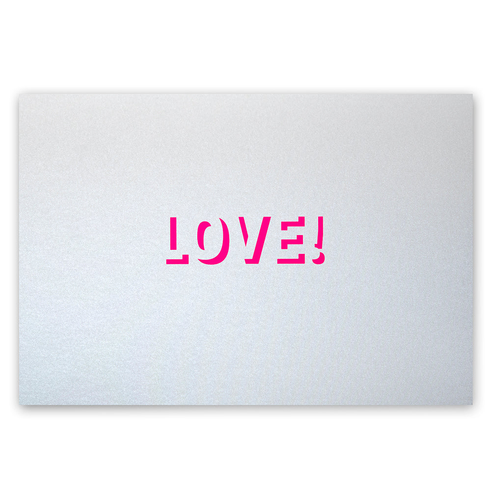 Silver greeting card with a smooth metallic surface and a centered pink “LOVE!” cutout.