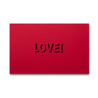 A flat red card featuring “LOVE!” cut out in the center, shown against a neutral background.