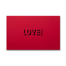 A flat red card featuring “LOVE!” cut out in the center, shown against a neutral background.