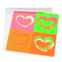Wrapping paper–style greeting card with four expressive brushstroke hearts arranged in a pop-art grid, set on bright neon backgrounds in pink, green, orange, and coral tones, shown partially inside a white envelope.