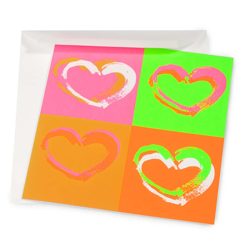 Wrapping paper–style greeting card with four expressive brushstroke hearts arranged in a pop-art grid, set on bright neon backgrounds in pink, green, orange, and coral tones, shown partially inside a white envelope.