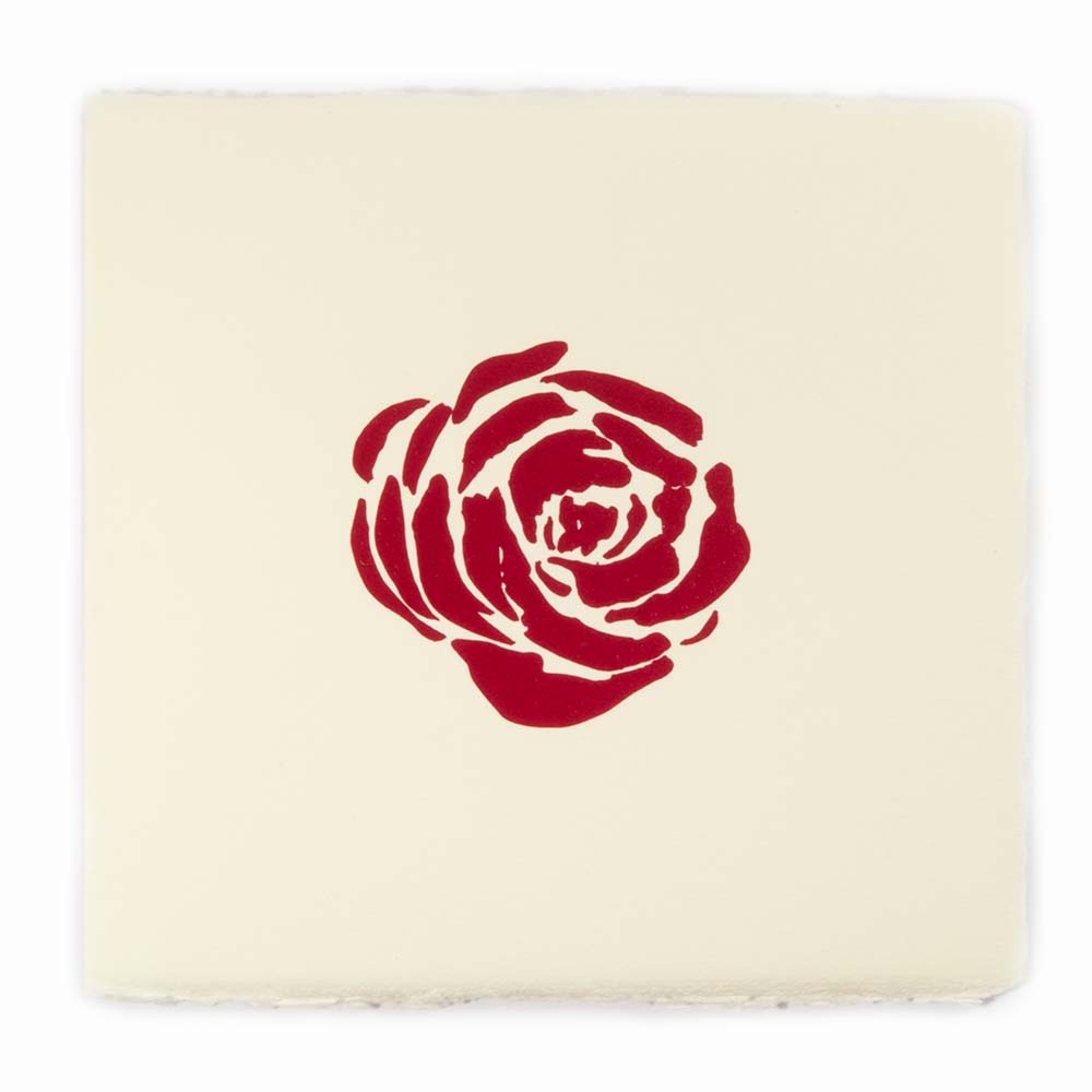 Square greeting card with deckled-edges, featuring a bold red rose centered on cream-colored handmade paper.