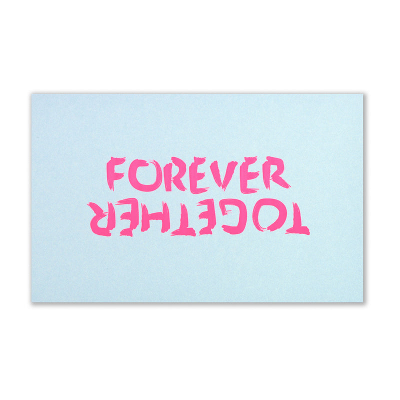 Forever Together greeting card laid flat on a white background, featuring large neon pink hand-painted lettering reading “FOREVER TOGETHER” against a soft light blue surface.