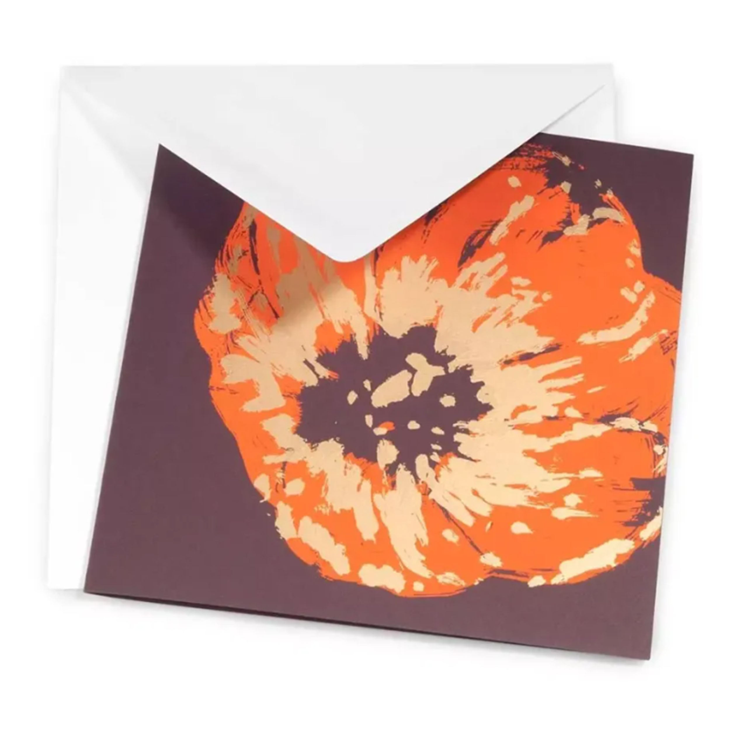 A greeting card partially tucked into a white envelope, showcasing a striking oversized poppy illustration with painterly textures and high-contrast colors on a dark backdrop.