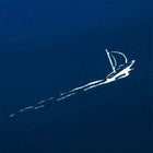 A close-up of a small white sailboat drawn against a rich blue gradient background, with a fine trailing line suggesting movement across calm water.
