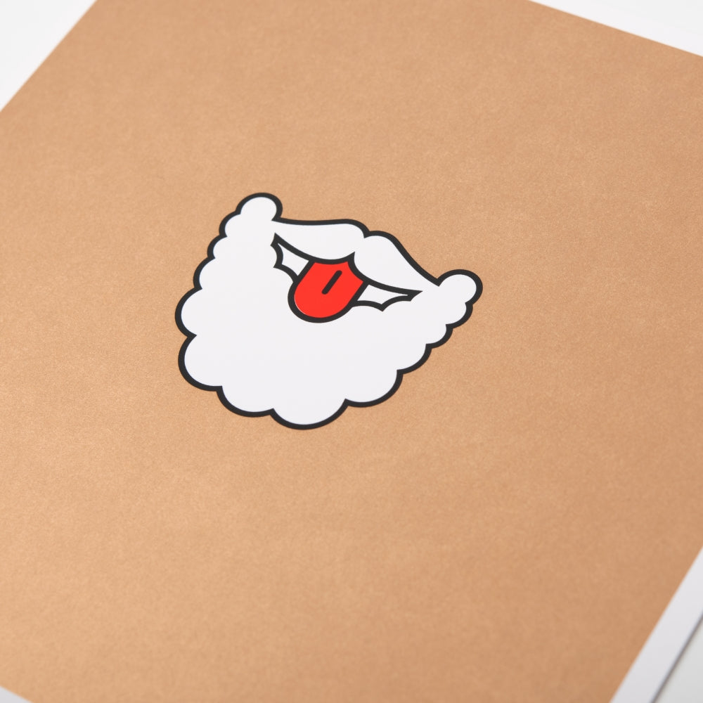 A close-up of a humorous Christmas card with a cartoon illustration of Santa’s white beard and mustache with his red tongue sticking out.