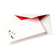 White Christmas card with a black illustration of a noble figure holding a large red Christmas ornament, paired with a red-lined envelope.