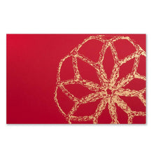 A Christmas card with a large golden bauble design on a bright red background.