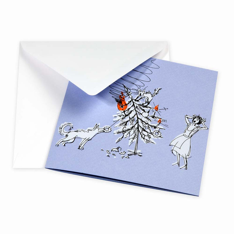 Humorous Christmas card on a light blue background showing a toppled Christmas tree, a playful dog, and a shocked woman reacting to the chaos, paired with a plain white envelope.