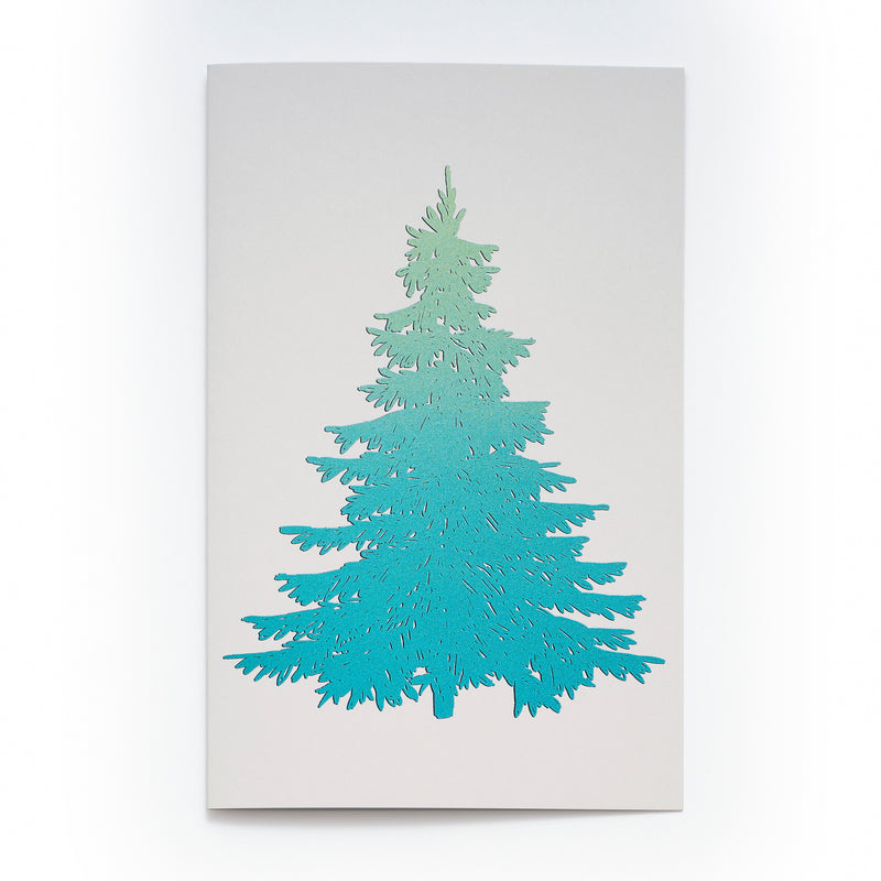 White Christmas card featuring a large stylized Christmas tree in shimmering blue foil.