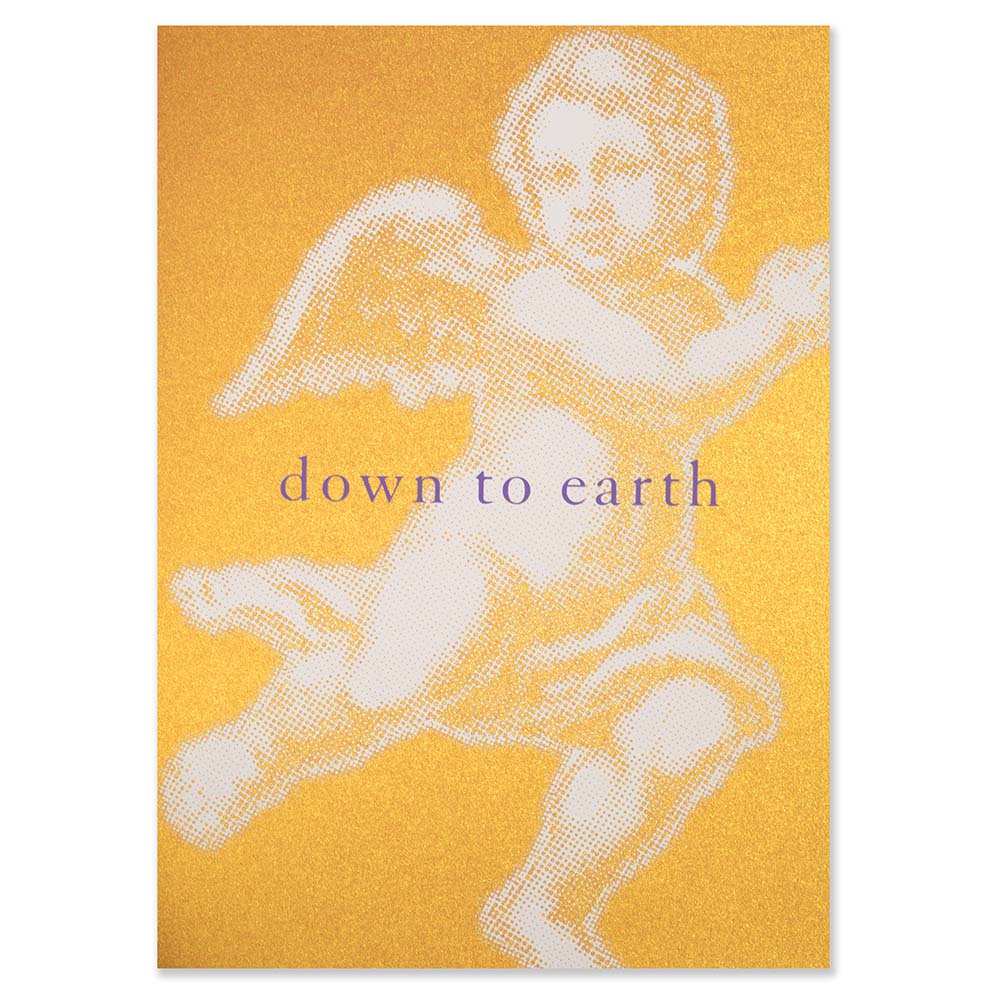 Elegant Christmas card with a shimmering gold-orange background, featuring a large pop-art-style white angel illustration and the text “down to earth.”