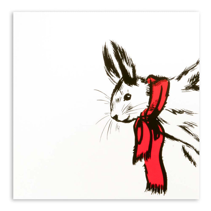 White Christmas card featuring a black sketch of a rabbit wearing a bright red scarf.