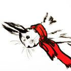 A close-up of a white Christmas card featuring a black sketch of a rabbit wearing a bright red scarf, paired with a plain white envelope