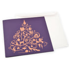 Purple Christmas card decorated with an ornate golden silhouette of a Christmas tree composed of animals, ornaments, and festive symbols, paired with a plain white envelope.
