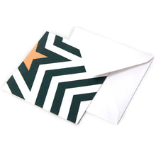 Christmas card featuring a bold zigzag pattern in dark green and white with a golden star forming a stylized Christmas tree, paired with a white envelope.