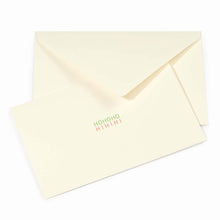 Minimalist cream-colored Christmas card with the words 'HOHOHO' in green and 'HIHIHI' in red printed in the center, paired with a matching cream envelope.