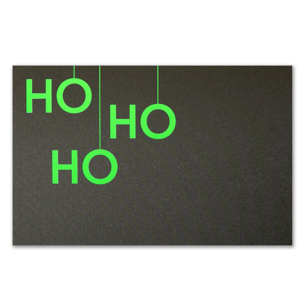 A black Christmas card with bold neon green letters arranged vertically to read "HO HO HO".