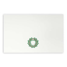 White Christmas card featuring a green holly wreath with red berries.
