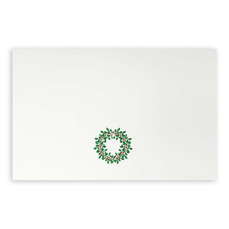 White Christmas card featuring a green holly wreath with red berries.