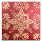 A Christmas card with a decorative golden star and floral pattern on a red background.